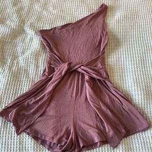 Purple one shoulder romper.
